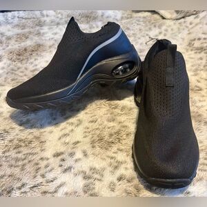 Black cloth slip on walking shoes. Slip resistant soles. Size 37